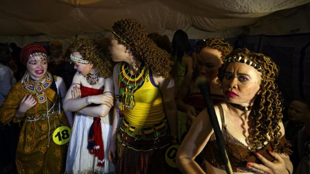 Contestants queue up to take the stage. Event organizer Isaac Mwaura, Kenya’s first albino legislator, called the pageant a way to build self-esteem. “People with albinism are people like any other, and for sure we are also beautiful,” he said. (Ben Curtis / AP)