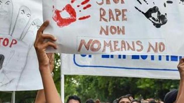 Activists display placards at a protest against a rape incident, New Delhi.(PTI File)