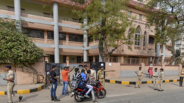 Police outside an examination centre for the Gujarat Police constable recruitment exam in Ahmedabad on Sunday. The exam was cancelled allegedly due to paper leak.(PTI)