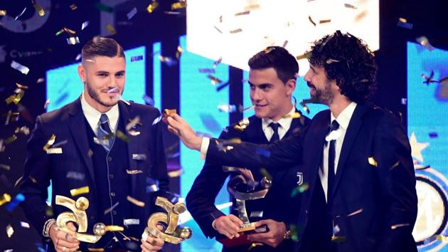 Inter's Argentinian forward Mauro Icardi (left) receives from AIC President Damiano Tommasi (right) the award for the best player of 2018.(AFP) Inter's Argentinian forward Mauro Icardi (left) receives from AIC President Damiano Tommasi (right) the award for the best player of 2018.(AFP)