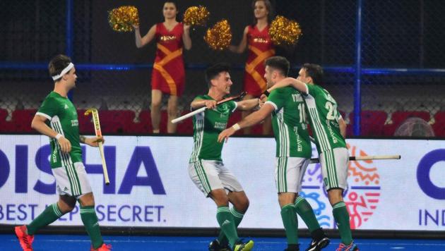 Ireland's player Shane O’Donoghue (2R) celebrates with teammates after scoring a goal during the field hockey group stage match between Australia and Ireland at the 2018 Hockey World Cup in Bhubaneswar on November 30, 2018(AFP)