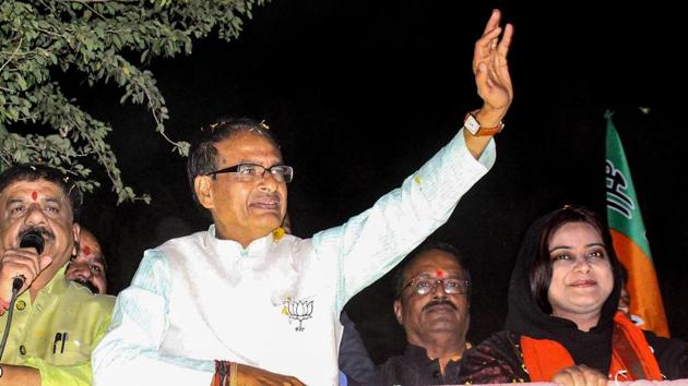 Assembly Elections 2018: File photo of Madhya Pradesh Chief Minister Shivraj Singh Chouhan at a roadshow in Bhopal. Chouhan has predicted a win for BJP in Chhattisgarh, MP and Rajasthan.(PTI)