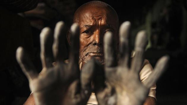 Ram Choudhuri, 80, has worked for more than 65 years preparing coal for the ovens and irons. Similarly, 74-year-old Panchu Lal Das has worked here for almost 50 years in scorching 44 degree Celsius summers and 4-5 degree winters. With the passing of time, what was once state-of-the-art has fallen far behind times, appearing antiquated. (Samir Jana / HT Photo) Ram Choudhuri, 80, has worked for more than 65 years preparing coal for the ovens and irons. Similarly, 74-year-old Panchu Lal Das has worked here for almost 50 years in scorching 44 degree Celsius summers and 4-5 degree winters. With the passing of time, what was once state-of-the-art has fallen far behind times, appearing antiquated. (Samir Jana / HT Photo)