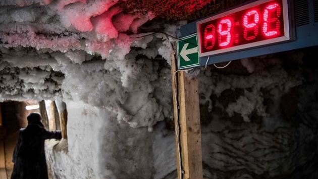 An electronic thermometer shows the temperature in the Museum of the History of Permafrost Studies located beneath the Melnikov Permafrost Institute Yakutsk, Russia. This city, one of the coldest on Earth, is hit by dangerous melting of its frozen ground, or permafrost, on which buildings stand. Average temperatures here have risen by 2.5 degrees Celsius over the past decade. (Mladen Antonov / AFP) An electronic thermometer shows the temperature in the Museum of the History of Permafrost Studies located beneath the Melnikov Permafrost Institute Yakutsk, Russia. This city, one of the coldest on Earth, is hit by dangerous melting of its frozen ground, or permafrost, on which buildings stand. Average temperatures here have risen by 2.5 degrees Celsius over the past decade. (Mladen Antonov / AFP)