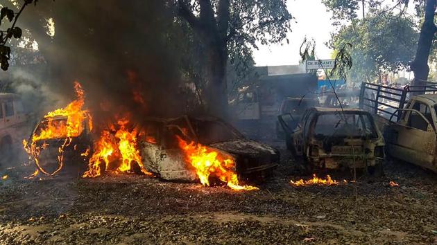 Bulandshahr: Vehicles set on fire by a mob during a protest over the alleged illegal slaughter of cattle, in Bulandshahr, Monday, Dec. 03, 2018. Police arrested eight people in connection with the case of alleged slaughter on Monday and after a cow carcass was found on Wednesday (PTI File Photo)(PTI)