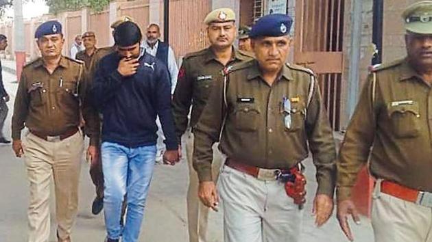 Accused Ashok Kumar in police custody after he was awarded death sentence by a court in Hisar on Wednesday (HT Photo) Accused Ashok Kumar in police custody after he was awarded death sentence by a court in Hisar on Wednesday (HT Photo)