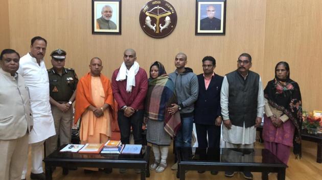 Uttar Pradesh chief minister Yogi Adityanath during a meeting with family members of slain cop Subodh Singh, who died on Tuesday after being attacked by mob protesting over alleged cow slaughter in Bulandshahr. He has assured the family of the cop that justice would be done to him and that the government will pay off all their educational and other loans, a minister said. (HT Photo) Uttar Pradesh chief minister Yogi Adityanath during a meeting with family members of slain cop Subodh Singh, who died on Tuesday after being attacked by mob protesting over alleged cow slaughter in Bulandshahr. He has assured the family of the cop that justice would be done to him and that the government will pay off all their educational and other loans, a minister said. (HT Photo)