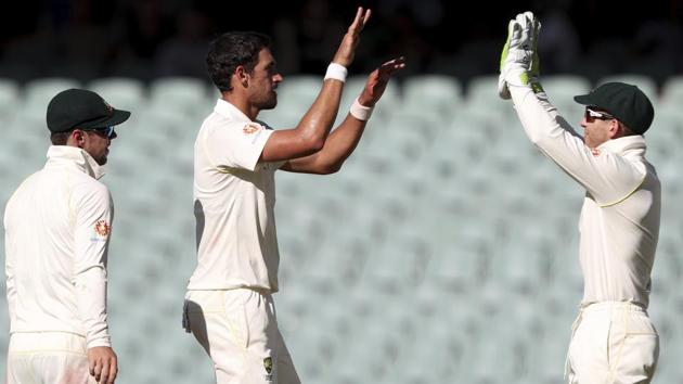 Australia's Mitchell Starc, centre, is congratulated by teammates after dismissing India's Ishant Sharma. (AP) 