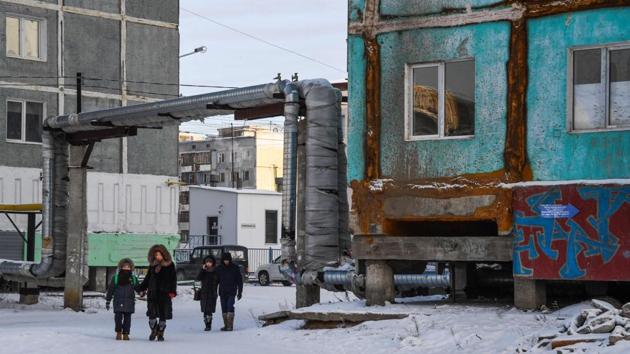 A view of a cracked and partially repaired panel apartment building. Russia’s environment ministry said in a report this year that deterioration of permafrost affects water, sewage and oil pipes as well as buried chemical, biological and radioactive substances. Melting permafrost enables any pollutants to spread faster and more widely, seeping through previously solid ground. (Mladen Antonov / AFP) A view of a cracked and partially repaired panel apartment building. Russia’s environment ministry said in a report this year that deterioration of permafrost affects water, sewage and oil pipes as well as buried chemical, biological and radioactive substances. Melting permafrost enables any pollutants to spread faster and more widely, seeping through previously solid ground. (Mladen Antonov / AFP)