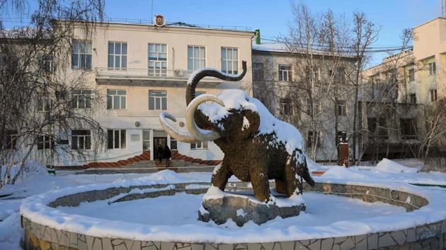 A mammoth sculpture is seen in front of the Permafrost Institute. One method to keep the ground frozen which is already available involves burying vertical metal tubes filled with a non-freezing agent like freon or kerosene in the ground with a part sticking out around or near a building. In winter the agent condenses and drops below the ground surface to keep it cold. (Mladen Antonov / AFP) A mammoth sculpture is seen in front of the Permafrost Institute. One method to keep the ground frozen which is already available involves burying vertical metal tubes filled with a non-freezing agent like freon or kerosene in the ground with a part sticking out around or near a building. In winter the agent condenses and drops below the ground surface to keep it cold. (Mladen Antonov / AFP)