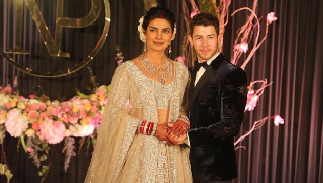 Newly-wed Bollywood actor Priyanka Chopra and American singer Nick Jonas pose for photos during their wedding reception, at Taj Palace, in New Delhi. (Photo By Manoj Verma/ Hindustan Times) Newly-wed Bollywood actor Priyanka Chopra and American singer Nick Jonas pose for photos during their wedding reception, at Taj Palace, in New Delhi. (Photo By Manoj Verma/ Hindustan Times)