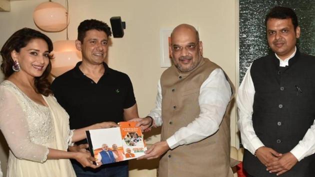 BJP chief Amit Shah and Maharashtra Chief Minister Devendra Fadnavis meet actress Madhuri Dixit and her husband Sriram Madhav Nene, in Mumbai. (IANS) BJP chief Amit Shah and Maharashtra Chief Minister Devendra Fadnavis meet actress Madhuri Dixit and her husband Sriram Madhav Nene, in Mumbai. (IANS)