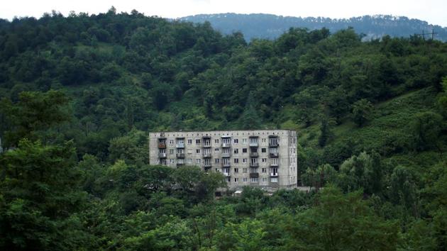 A Soviet-era apartment building is seen in Tkibuli. The town is located in the lowlands of a scenic mountain gorge though the city itself is a typical Soviet-built industrial town with grey shabby houses and unsightly streets. (David Mdzinarishvili / REUTERS)