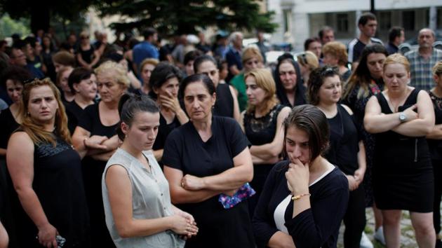 People mourn during a funeral for miners who died during an accident at the Mindeli mine. Others are of the opinion that the deadly mine should be shut down. “Agricultural farms should be built around the city. That would be an alternative to the mine,” said 16-year-old Luka Bakradze. (David Mdzinarishvili / REUTERS)