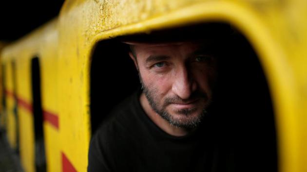 Miner Gocha Gabunia, 34, waits in a train before entering the mine. Gocha has worked here for 15 years. “If there was a chance to find another job in this city, nobody would work at the mine,” he said. He was also slightly injured in one of the accidents, though he got back to work a few days after that. “Once I was buried alive in a mine and was saved 30 minutes later.” (David Mdzinarishvili / REUTERS)