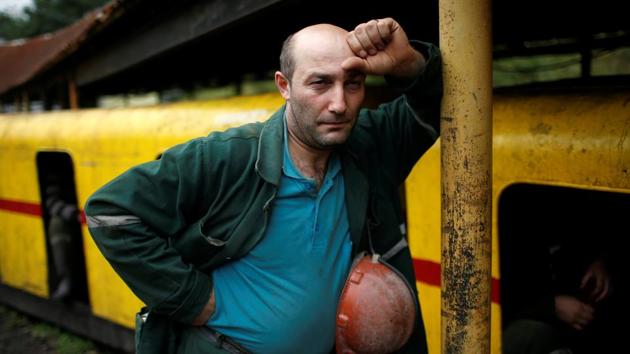 Miner David Kublashvili, 38, waits to enter the Mindeli mine in Tkibuli, Georgia. When the roof of the coal mine collapsed in July, killing four miners and injuring six, the small town was plunged into grief but not for the first time. Just three months previously in April in an accident at the same pit, six miners were killed and three injured. (David Mdzinarishvili / REUTERS)