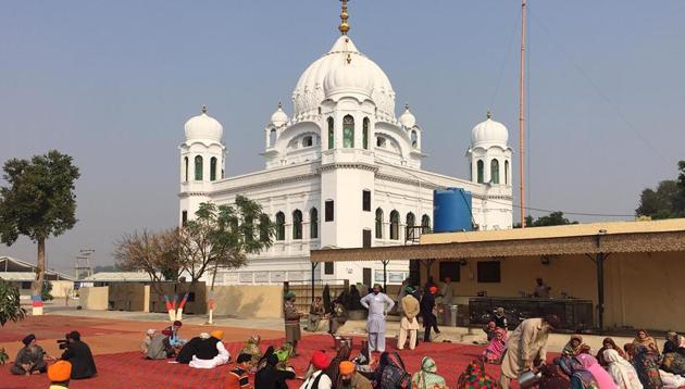 Sikh Pilgrims sit in front of Kartarpur Gurdwara Sahib. The MEA asserted that Pakistan has “attempted to politicise a religious issue related to the sentiments of the Sikh community.”(AFP)