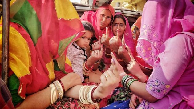 Women seated in a vehicle show their inked finger after casting their vote at a polling booth in Japipur, Rajasthan. Till 1 pm the voter turnout was recorded 41.53%. In Ahor, EVMs malfunctioned where as Sikar’s Fatehpur witnessed clashes between two groups in which vehicles were set on fire and vandalised. (Himanshu Vyas / HT Photo) Women seated in a vehicle show their inked finger after casting their vote at a polling booth in Japipur, Rajasthan. Till 1 pm the voter turnout was recorded 41.53%. In Ahor, EVMs malfunctioned where as Sikar’s Fatehpur witnessed clashes between two groups in which vehicles were set on fire and vandalised. (Himanshu Vyas / HT Photo)