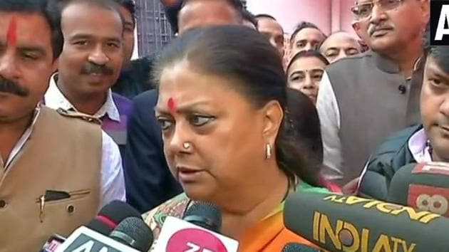 Rajasthan Chief Minister Vasundhara Raje speaks to reporters after casting her vote on Friday.(ANI photo)