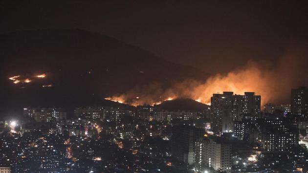 A fire blazes through the Aarey forest near Goregaon, in Mumbai. An overnight operation managed to contain the fire which was limited to vegetation. No casualties were reported. (Satyabrata Tripathy / HT Photo) A fire blazes through the Aarey forest near Goregaon, in Mumbai. An overnight operation managed to contain the fire which was limited to vegetation. No casualties were reported. (Satyabrata Tripathy / HT Photo)