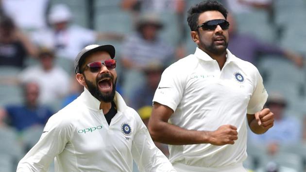 India's captain Virat Kohli and his teammate Ravichandran Ashwin celebrate the dismissal of Australia's Marcus Harris. (REUTERS)