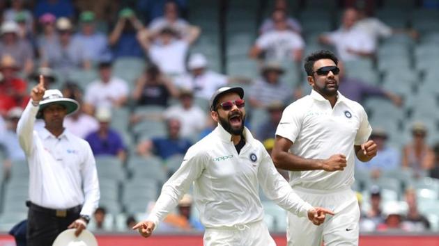 India's captain Virat Kohli and his teammate Ravichandran Ashwin celebrate the dismissal of Australia's Marcus Harris during day two of the first test match between Australia and India at the Adelaide Oval in Adelaide. (REUTERS) India's captain Virat Kohli and his teammate Ravichandran Ashwin celebrate the dismissal of Australia's Marcus Harris during day two of the first test match between Australia and India at the Adelaide Oval in Adelaide. (REUTERS)