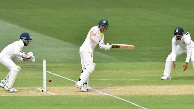 Australia's batsman Travis Head (C) plays a shot on day two of the first test match between Australia and India at the Adelaide Oval. (REUTERS) Australia's batsman Travis Head (C) plays a shot on day two of the first test match between Australia and India at the Adelaide Oval. (REUTERS)