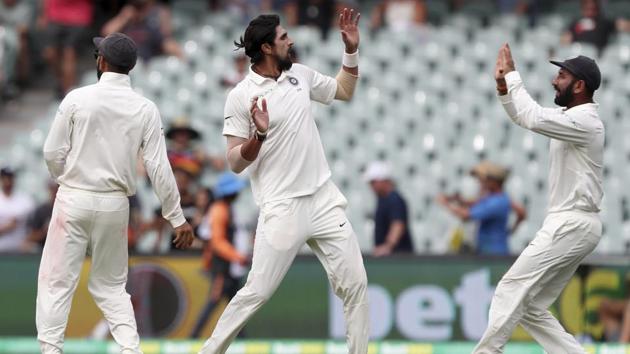 India's Ishant Sharma, centre, celebrates with his teammates after dismissing Australia's Tim Paine. (AP)
