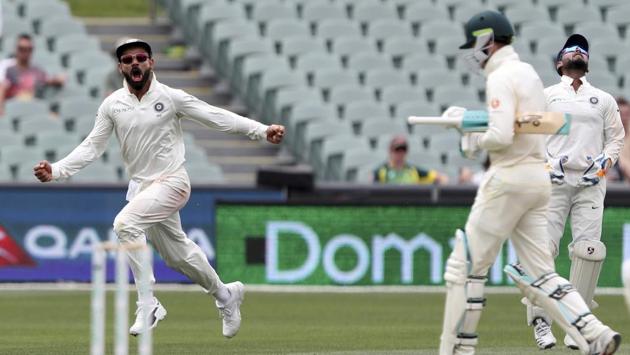 India’s Virat Kohli, (L), celebrates the dismissal of Australia’s Peter Handscomb, (R), during the first cricket test between Australia and India in Adelaide, Australia. (James Elsby / AP) India’s Virat Kohli, (L), celebrates the dismissal of Australia’s Peter Handscomb, (R), during the first cricket test between Australia and India in Adelaide, Australia. (James Elsby / AP)