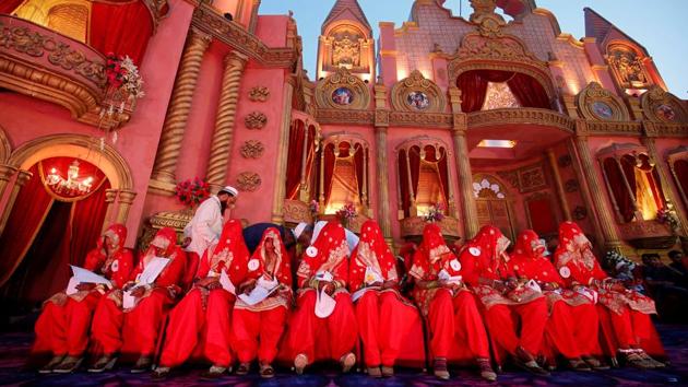 Brides wait to take their wedding vows during a mass marriage ceremony in which, according to its organisers, 65 Muslim couples were hitched in Ahmedabad, Gujarat. (Amit Dave / REUTERS) Brides wait to take their wedding vows during a mass marriage ceremony in which, according to its organisers, 65 Muslim couples were hitched in Ahmedabad, Gujarat. (Amit Dave / REUTERS)