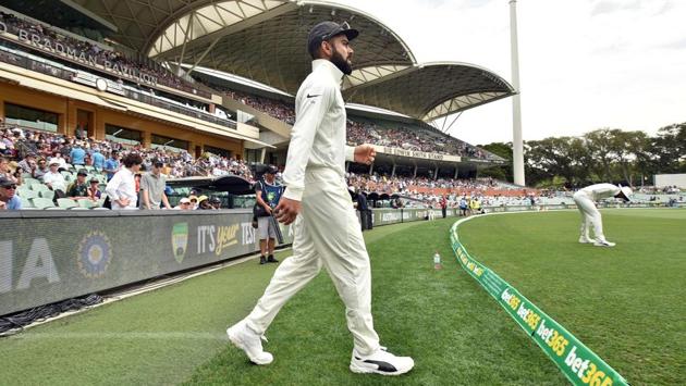 Indian cricket team captain Virat Kohli walks out to field against Australia. (AFP)