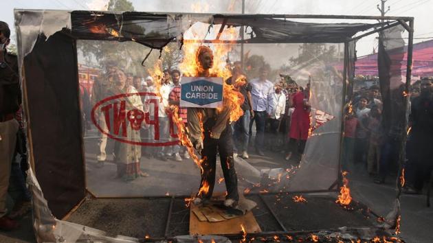 Demonstrators burn an effigy with logos of Dupont, DOW Chemicals and Union Carbide during the 34th anniversary of the Bhopal gas disaster in Bhopal, Madhya Pradesh. (Gagan Nayar / AFP) Demonstrators burn an effigy with logos of Dupont, DOW Chemicals and Union Carbide during the 34th anniversary of the Bhopal gas disaster in Bhopal, Madhya Pradesh. (Gagan Nayar / AFP)