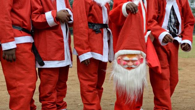 Schoolchildren dressed as Santa Claus pose take part in a Christmas event at a school in Chennai, Tamil Nadu. (Arun Sankar / AFP) Schoolchildren dressed as Santa Claus pose take part in a Christmas event at a school in Chennai, Tamil Nadu. (Arun Sankar / AFP)