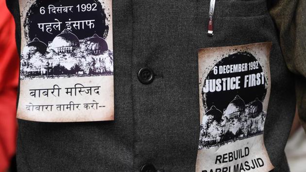 A pro-Muslim activist is seen with stickers pasted on his jacket on the 26th anniversary of the demolition of the 16th century Babri Masjid located in Ayodhya, in New Delhi. (Sajjad Hussain / AFP) A pro-Muslim activist is seen with stickers pasted on his jacket on the 26th anniversary of the demolition of the 16th century Babri Masjid located in Ayodhya, in New Delhi. (Sajjad Hussain / AFP)