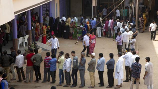 Telangana assembly elections 2018: People stand in a queue to cast their votes in Hyderabad.(AP Photo)