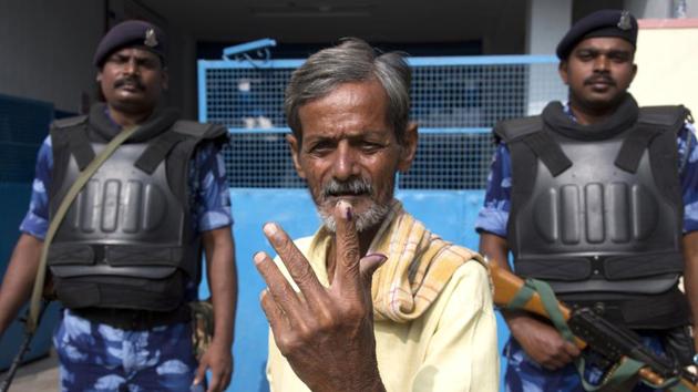 An Indian displays the indelible ink mark on his index fingers after casting his vote in Hyderabad, India, Friday, December 7, 2018. This is the first state elections in Telangana after it was formed bifurcating Indian state of Andhra Pradesh.(AP file photo)