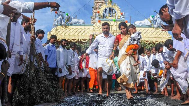 Devotees walk on embers during Sri Veerabhadreshwara Swamy Kendotsava in Chikmagalur, Karnataka. (PTI) Devotees walk on embers during Sri Veerabhadreshwara Swamy Kendotsava in Chikmagalur, Karnataka. (PTI)