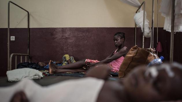 A mother watches her HIV-positive child under observation in the intensive care unit of the paediatric complex, while in the foreground, an HIV-positive child sleeps. “CAR is one of the most difficult countries to be a child,” Donaig Le Dru, UNICEF spokesperson in CAR, told AFP. The statistics underline the horrors that stalk childhood in the country. (Florent Vergnes / AFP) A mother watches her HIV-positive child under observation in the intensive care unit of the paediatric complex, while in the foreground, an HIV-positive child sleeps. “CAR is one of the most difficult countries to be a child,” Donaig Le Dru, UNICEF spokesperson in CAR, told AFP. The statistics underline the horrors that stalk childhood in the country. (Florent Vergnes / AFP)