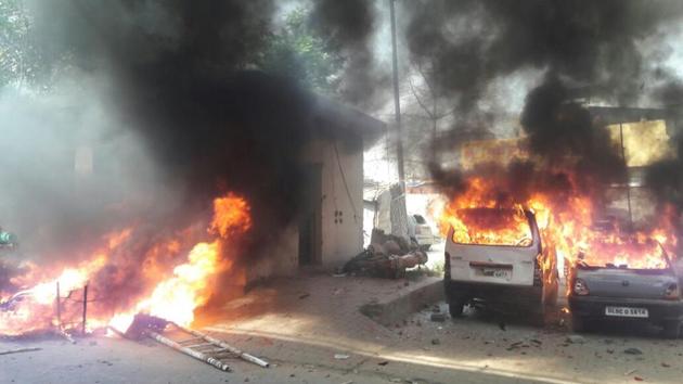 Vehicles torched by a mob which attacked policemen during a protest against Supreme Court ruling on SC/ST Act. (HT File Photo) Vehicles torched by a mob which attacked policemen during a protest against Supreme Court ruling on SC/ST Act. (HT File Photo)