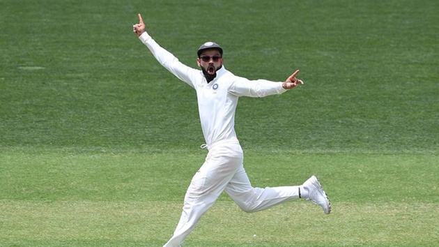 India's captain Virat Kohli reacts to the dismissal of Australian batsman Usman Khawaja who was given out on review from the bowling of Ravichandran Ashwin on day two.(REUTERS)