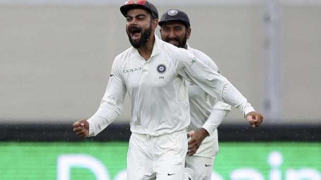 India's Virat Kohli reacts after teammate India's Jasprit Bumrah took the wicket of Australia's Mitchell Starc. (AP)