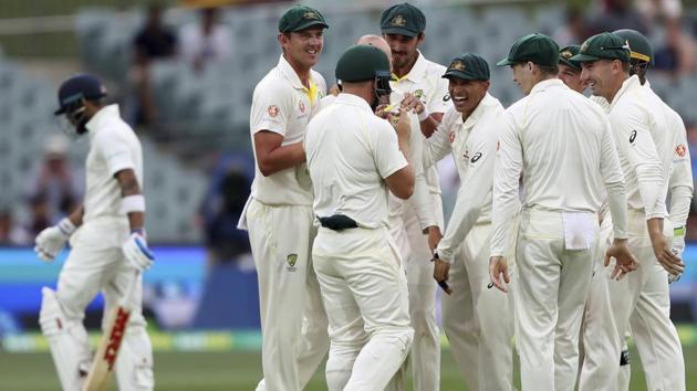 Australian players celebrate the dismissal of India's Virat Kohli. (AP)