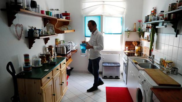 Saliba in the kitchen of his apartment in Berlin. Authorities refused to give him a refugee travel document and referred him to the Syrian embassy in Berlin. Saliba said he did not want to enter the embassy of the government from which he had fled and he is suing the German government to get a refugee passport. “I fled the lack of freedom to get freedom here,” he said. (Fabrizio Bensch / REUTERS) Saliba in the kitchen of his apartment in Berlin. Authorities refused to give him a refugee travel document and referred him to the Syrian embassy in Berlin. Saliba said he did not want to enter the embassy of the government from which he had fled and he is suing the German government to get a refugee passport. “I fled the lack of freedom to get freedom here,” he said. (Fabrizio Bensch / REUTERS)