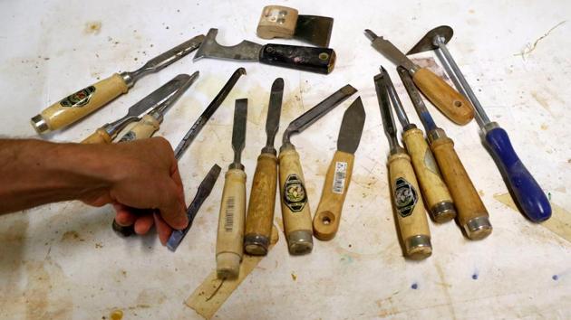 Joseph Saliba sorts his tools in a workshop inside the Berlin Cathedral. His German language class went on a field trip to Cathedral and immediately he felt a connection. He offered to volunteer in restoration work at the church using tools he had made himself. A year later, the church offered him a paid job. The church became a home but not Germany. (Fabrizio Bensch / REUTERS) Joseph Saliba sorts his tools in a workshop inside the Berlin Cathedral. His German language class went on a field trip to Cathedral and immediately he felt a connection. He offered to volunteer in restoration work at the church using tools he had made himself. A year later, the church offered him a paid job. The church became a home but not Germany. (Fabrizio Bensch / REUTERS)