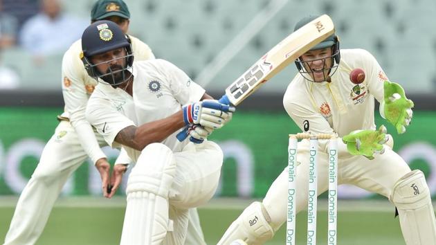 India's batsman Murali Vijay plays a shot in front of Australia's captain and wicket-keeper Tim Paine (R). (AFP)