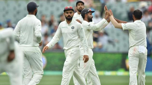 India's players celebrate the wicket of Australia's batsman Josh Hazlewood. (AFP)