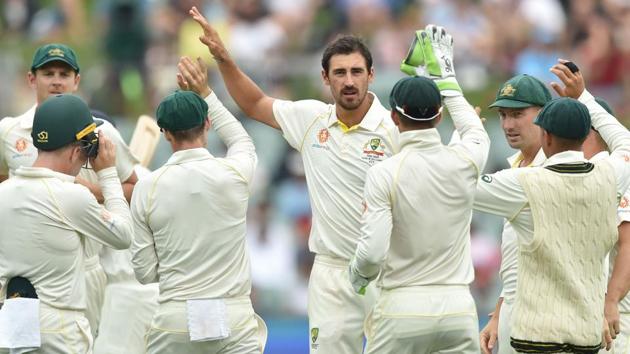 Australia's fast bowler Mitchell Starc (C) celebrates with teammates after taking the wicket of India's batsman Murali Vijay. (AFP)