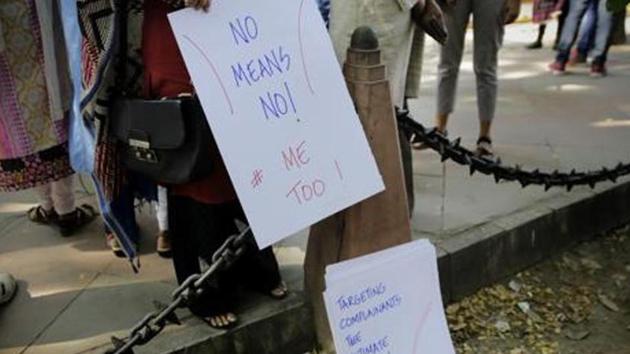 An Indian journalist picks up a placard from a stack during a protest against sexual harassment in the workplace in New Delhi. Image for representation.(AP file photo) An Indian journalist picks up a placard from a stack during a protest against sexual harassment in the workplace in New Delhi. Image for representation.(AP file photo)