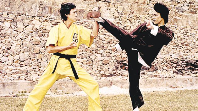 Bruce Lee (in black) in his breakout 1973 film, Enter The Dragon. By the time the film made him a global superstar, he was dead. He was just 32.(Corbis via Getty Images)