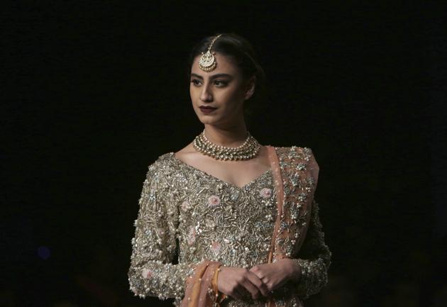 A model presents a creation by designer Reema Hasan during Bridal Couture Week, in Lahore, Pakistan. (AP) A model presents a creation by designer Reema Hasan during Bridal Couture Week, in Lahore, Pakistan. (AP)